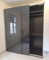 Large closet with glass sliding door image 5