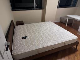 A wooden bed frame and a mattress image 2