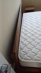 A wooden bed frame and a mattress image 5