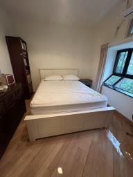Lovely white queen-sized bed image 1