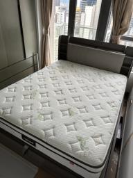 Queen sized bed with mattress and storag image 1