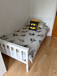 single wooden bed with mattress image 1