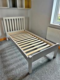 single wooden bed with mattress image 1