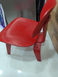Red Eames molded plywood lounge chair image 2