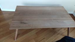 A wooden coffee table image 1