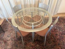 Glass-topped dining table  4 chairs image 1