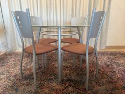 Glass-topped dining table  4 chairs image 2