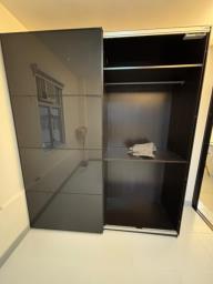 Large closet with glass sliding door image 3