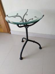 Wrought-iron side table with glass top image 1