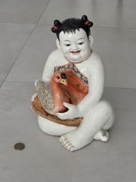 Chinese porcelain baby with goose image 1