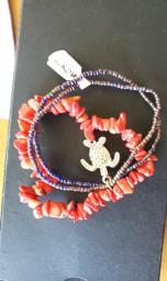 red coral chips bracelet with pouch image 1