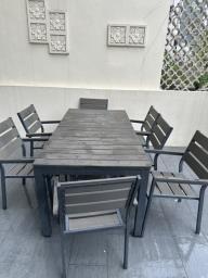 Outdoor table and 8 chairs image 1