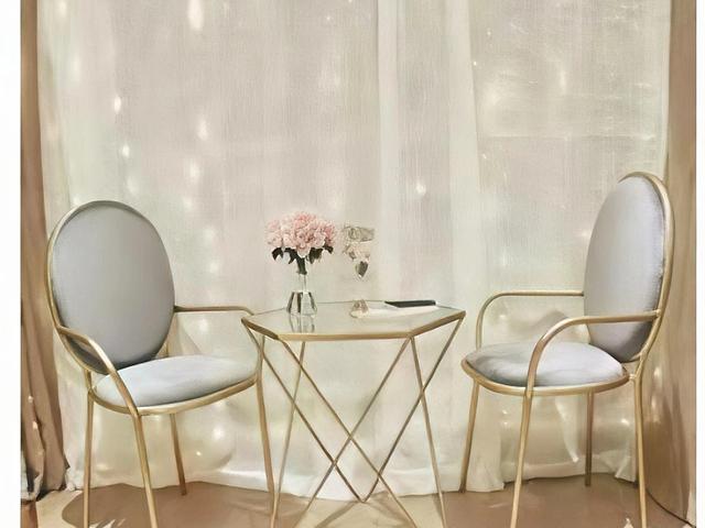 Gold-framed glass table and chairs