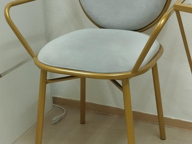 Gold-framed glass table and chairs