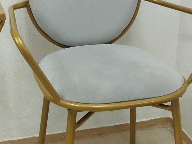Gold-framed glass table and chairs