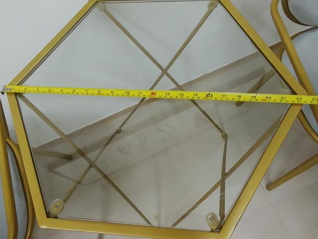 Gold-framed glass table and chairs