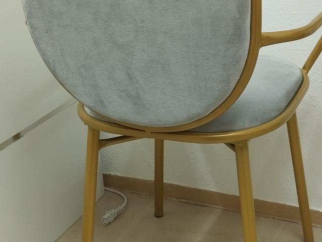 Gold-framed glass table and chairs
