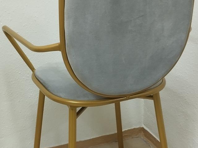 Gold-framed glass table and chairs