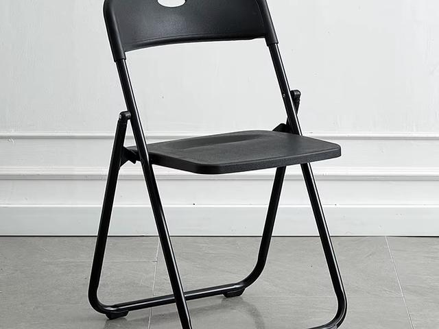 Black plastic and gray metal folding chairs