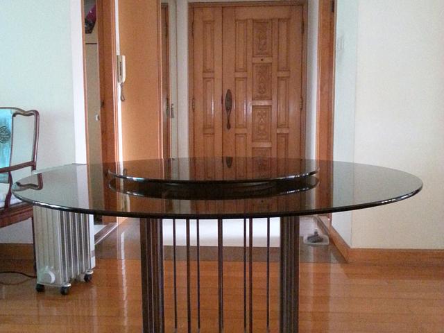 Designer dining table, metal base, glass top 