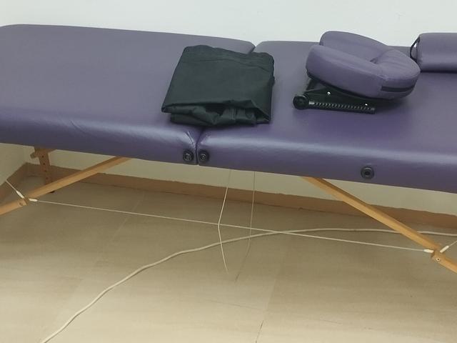 Portable folding wooden massage table